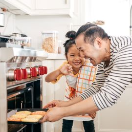 Dad and daughter baking