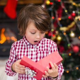 Child opening Christmas gift