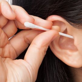 Woman using Q-tip