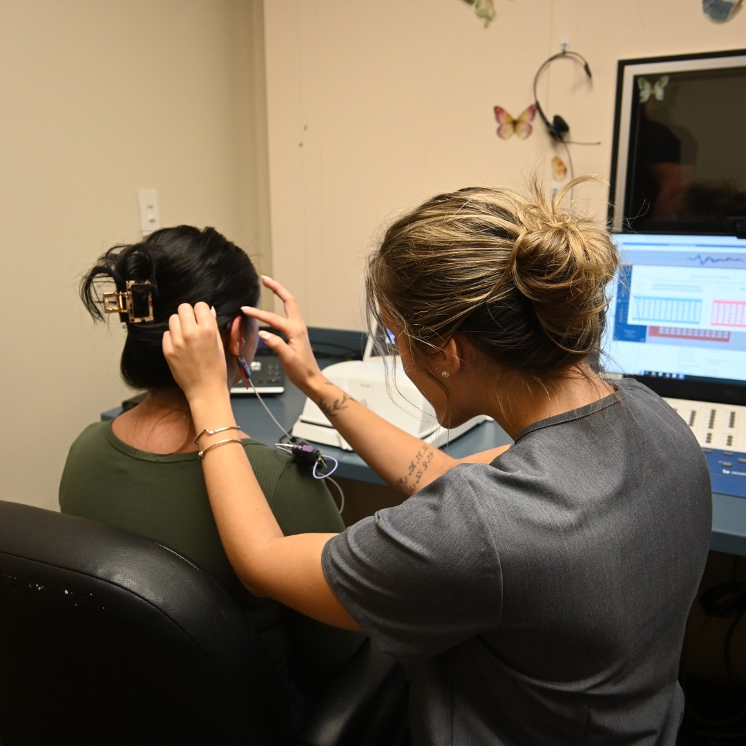 student providing hearing exam