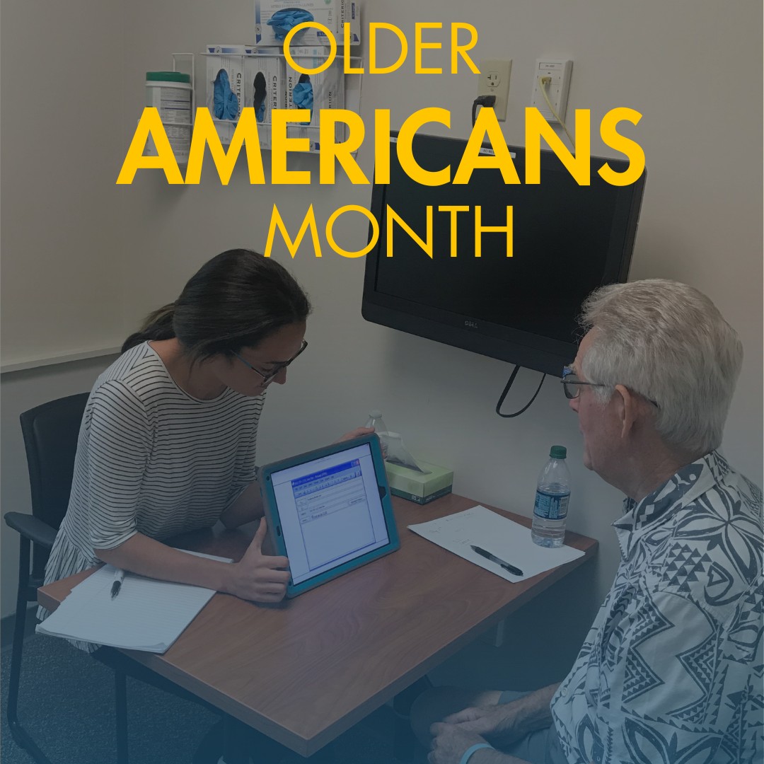 SLP showing tablet to older man