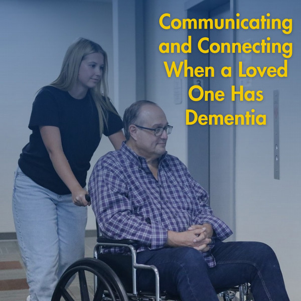 SLP student pushing patient in wheelchair