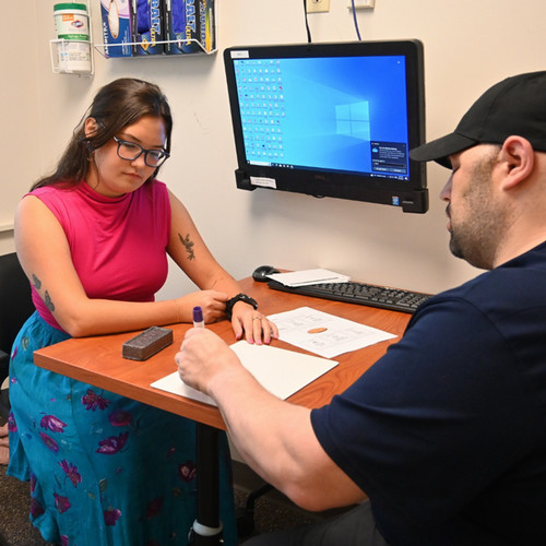 SLP working with client