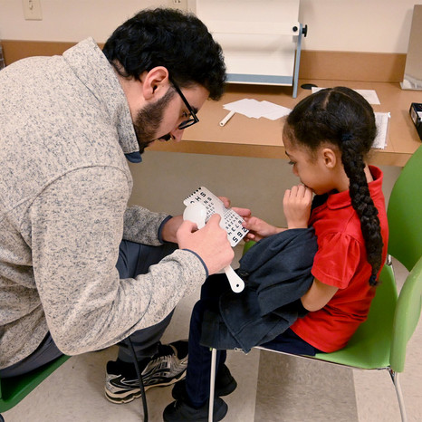 child getting their eyes examined