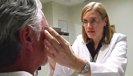 Dr. Mallow examining a patient