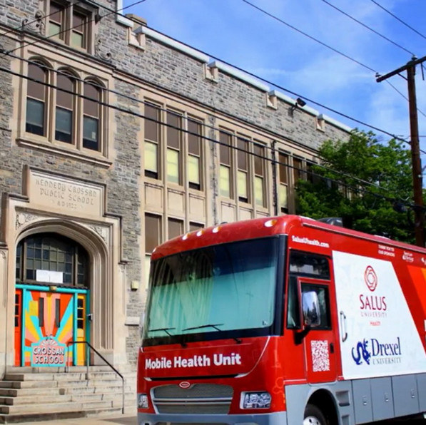 mobile health unit parked outside of Crossan School