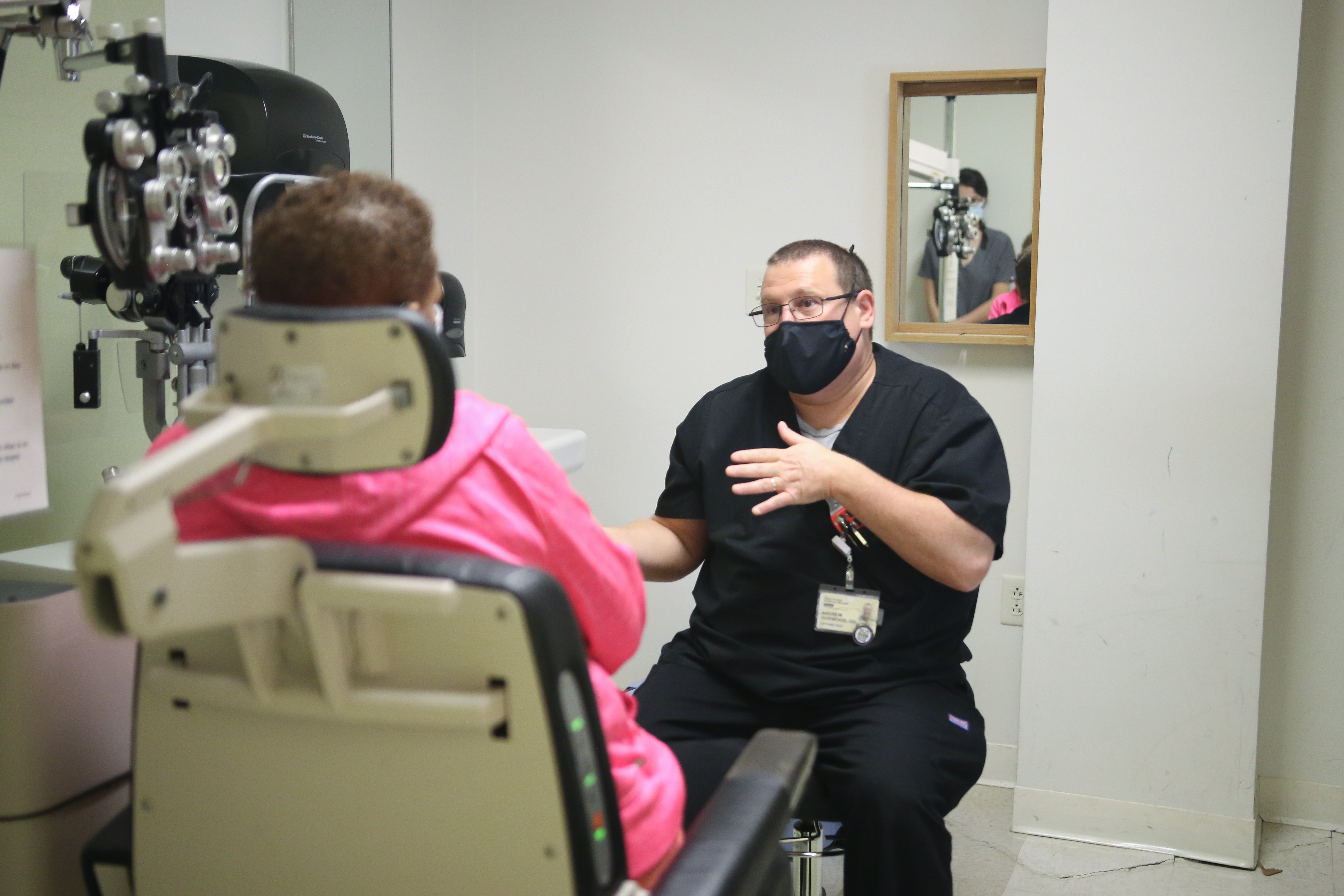 Dr.Gurwood in exam room with patient