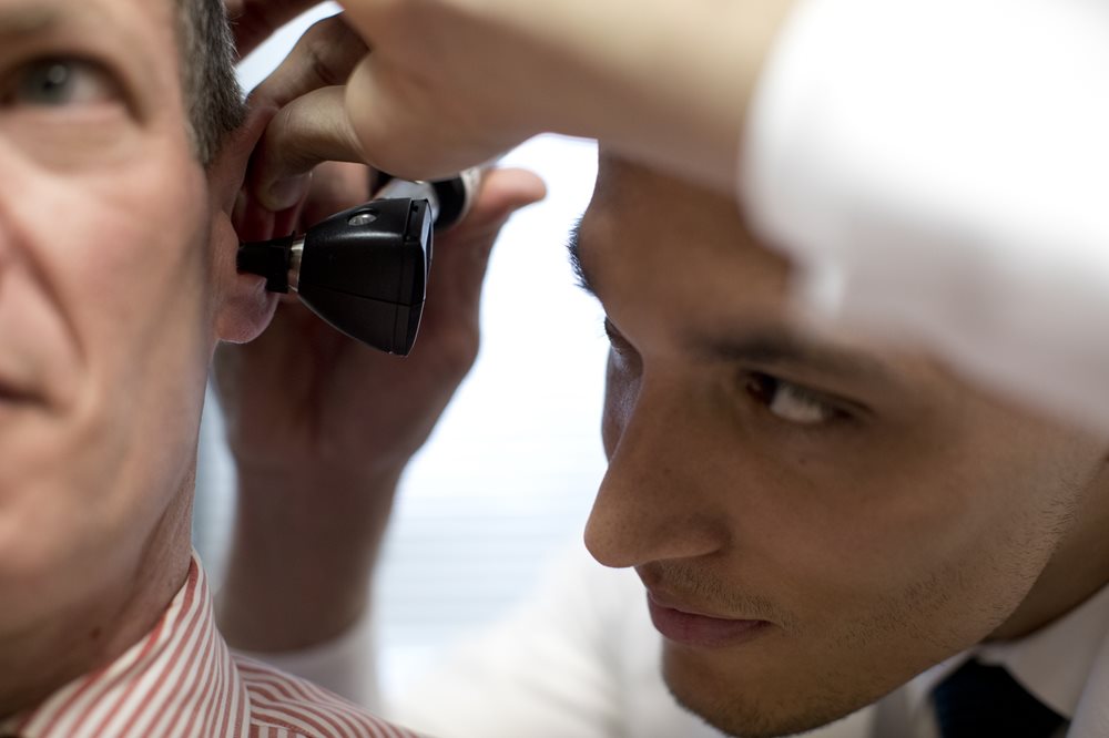 man getting his ear examined