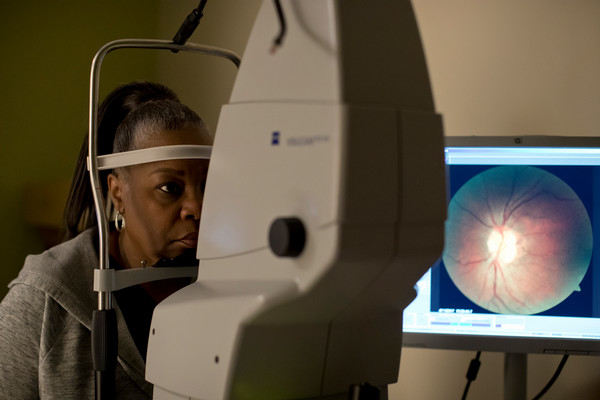woman getting retina scan