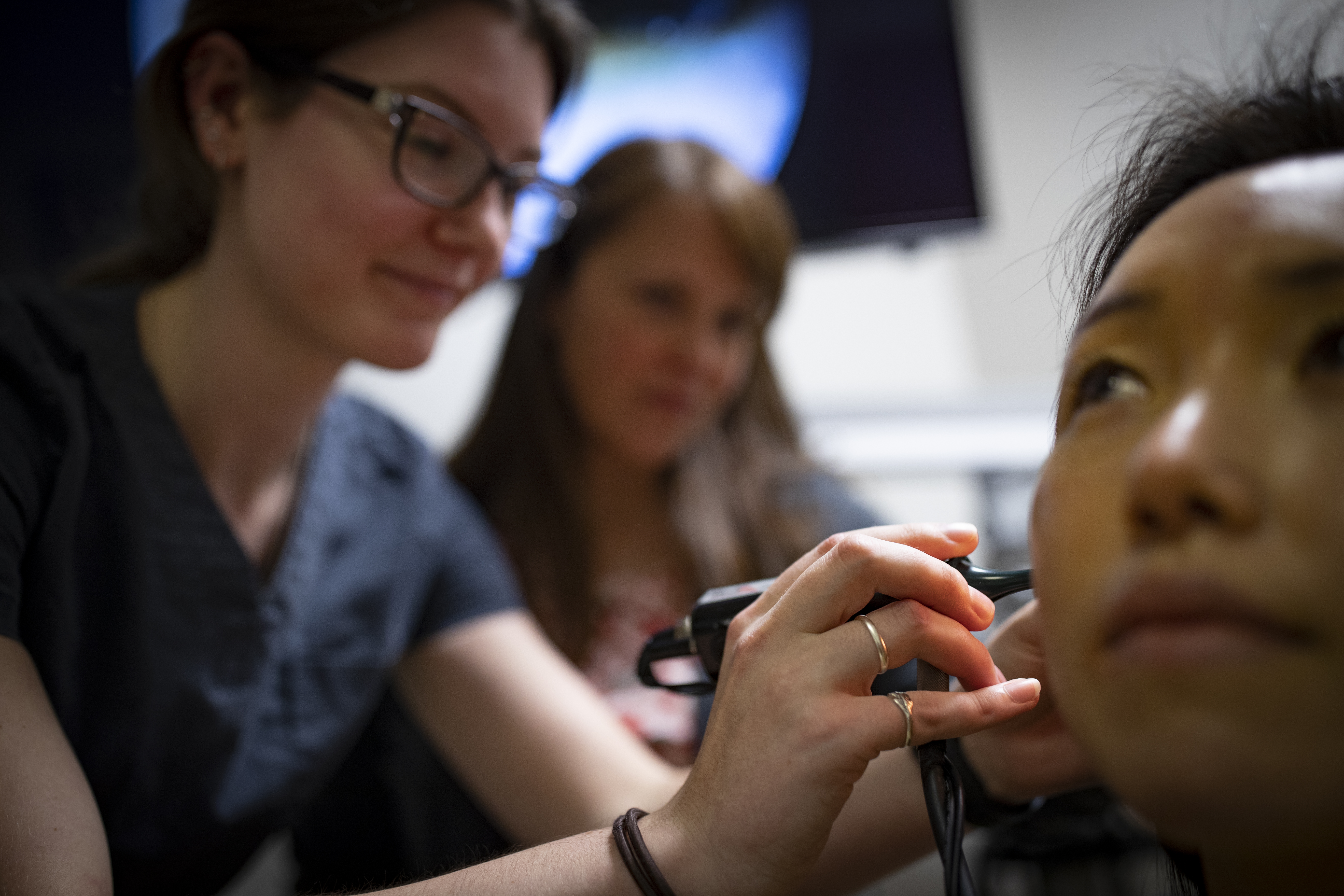 Patient getting her ears checked pic