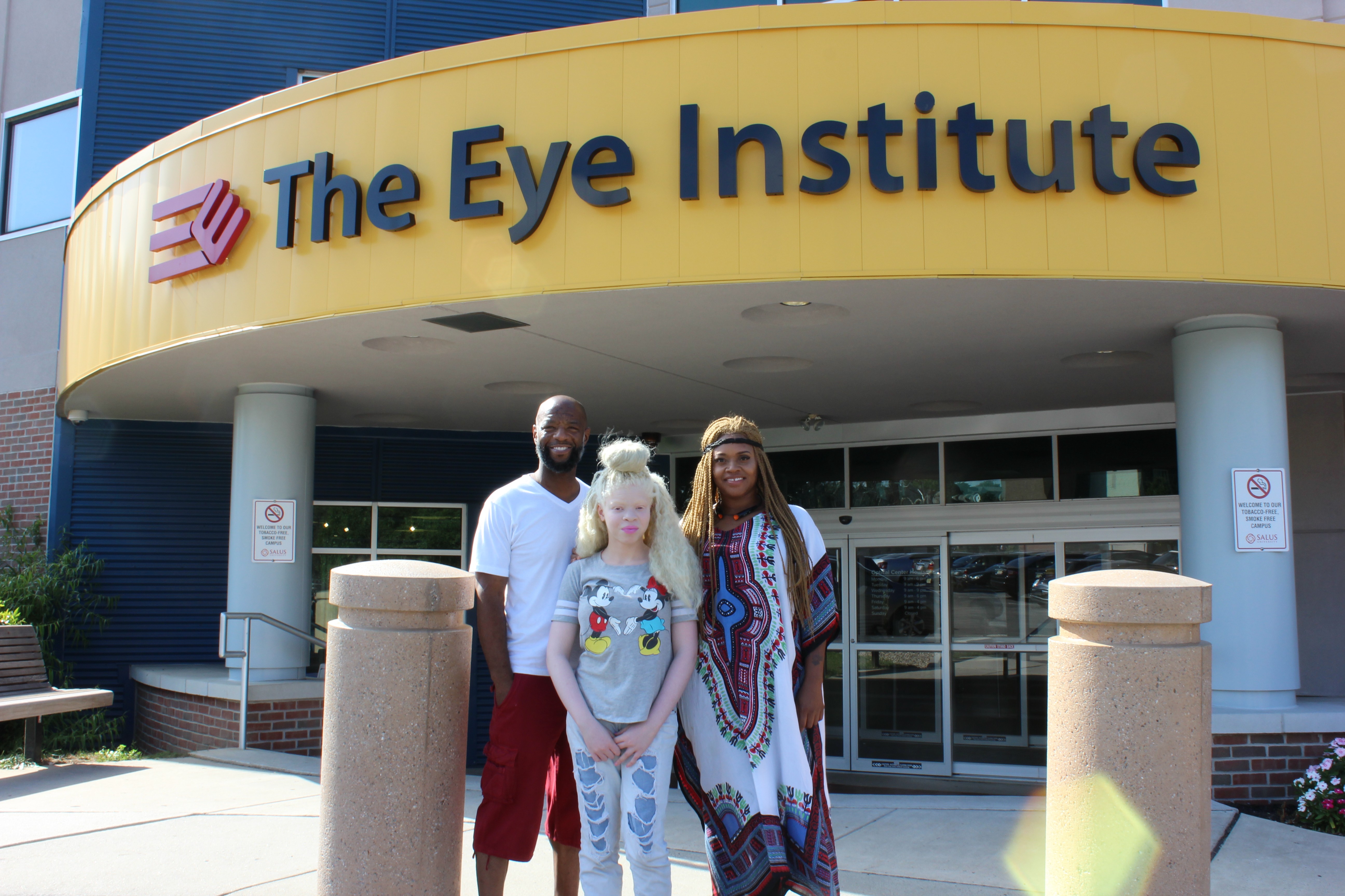 Albino child with parents at TEI