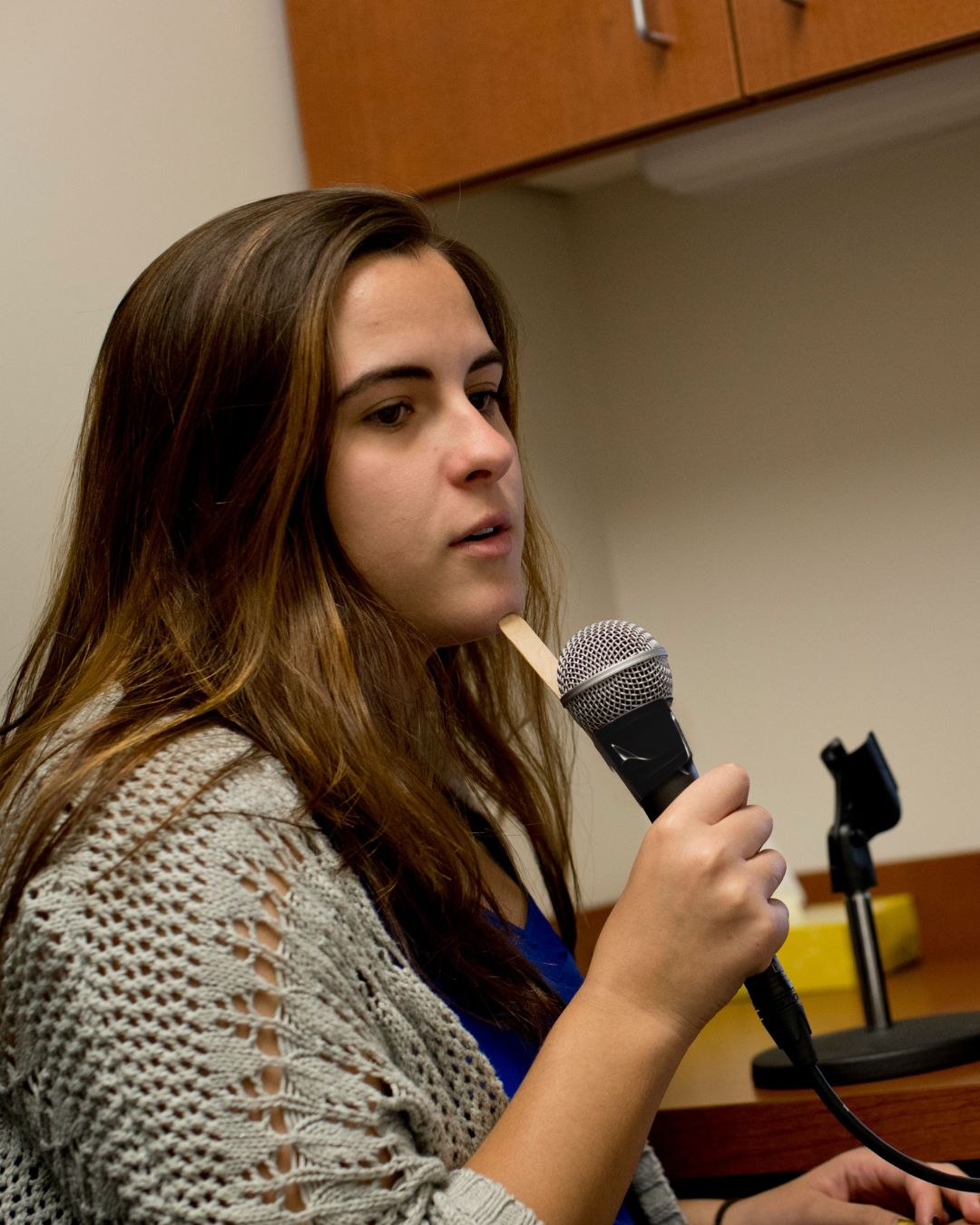 client holding microphone