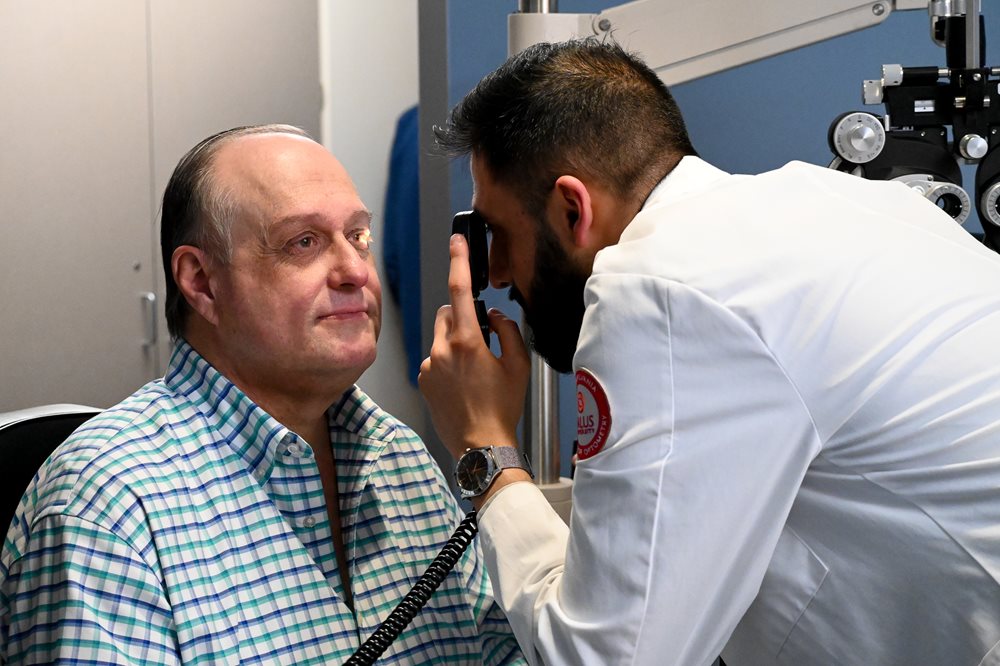 A big galoot having his eyes checked at TEI
