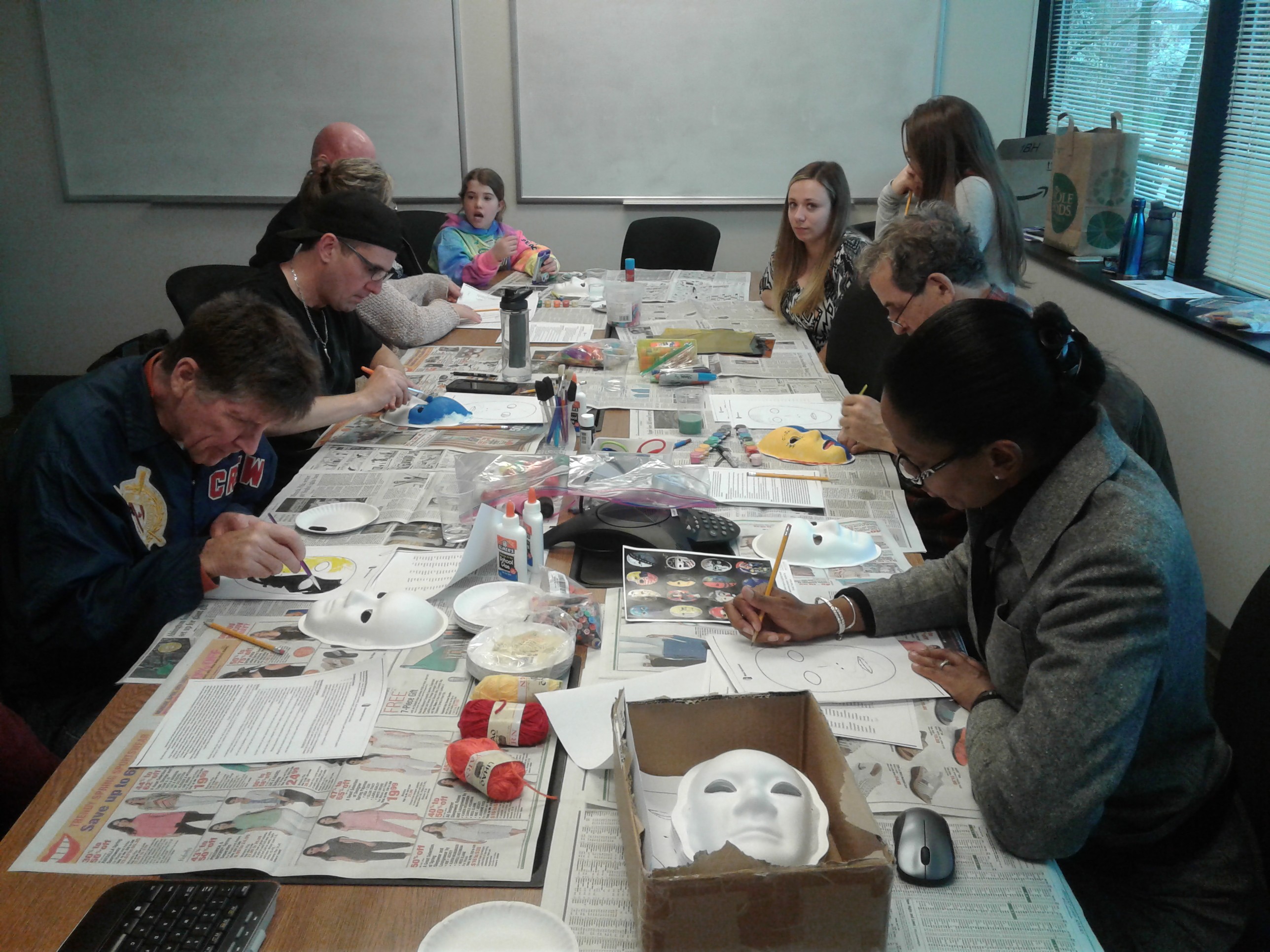 SLI patients at a table working on crafts