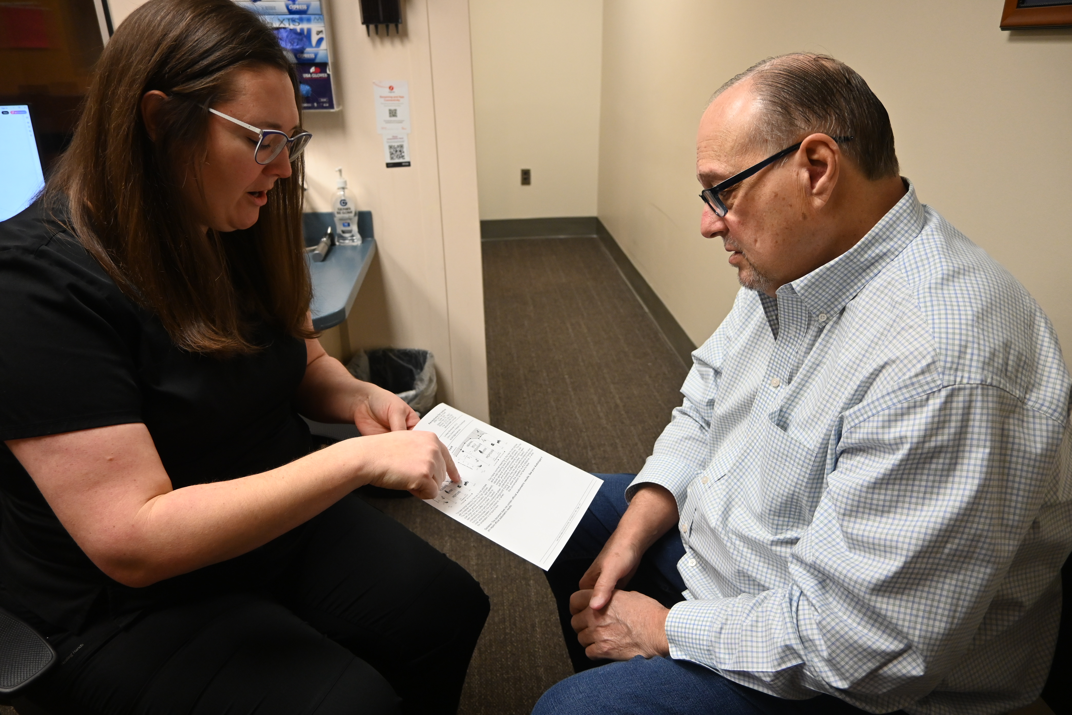 Audiologist counseling a patient