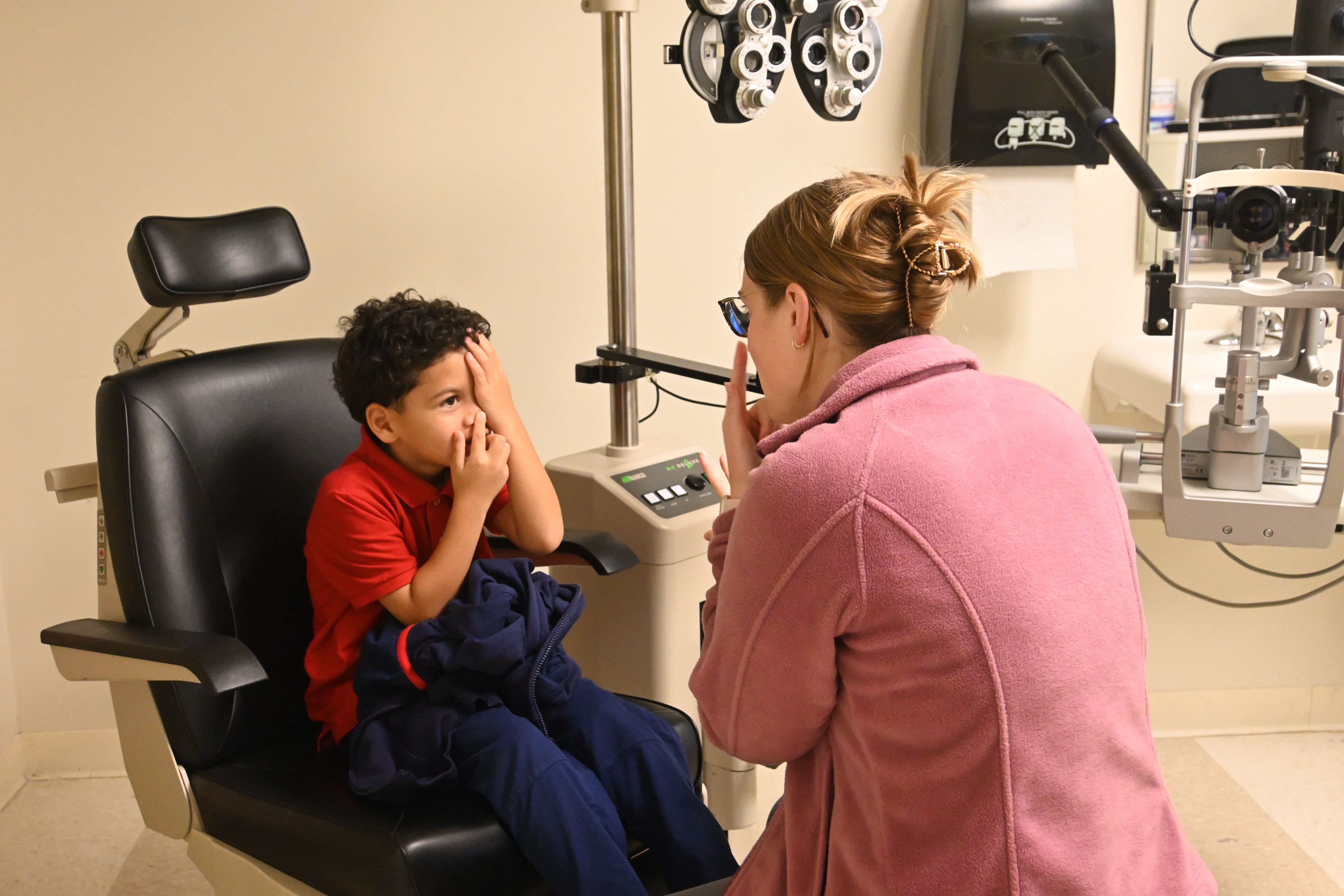 Young male patient being given an eye exam