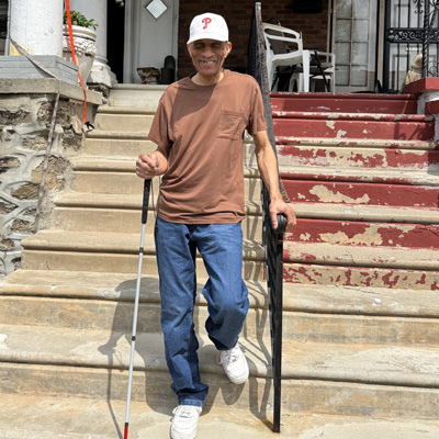 man holding a white cane