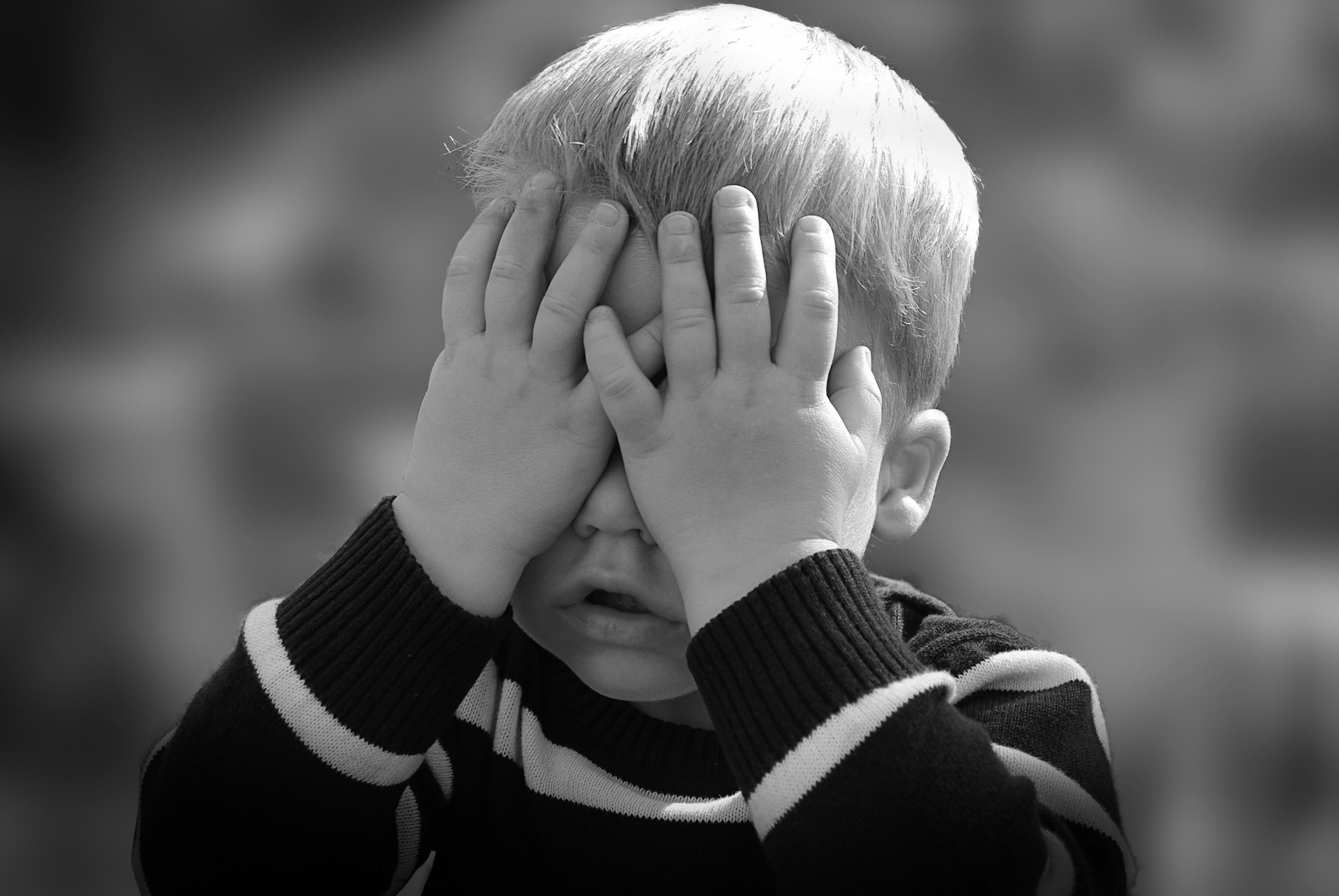 Child covering eyes from fireworks