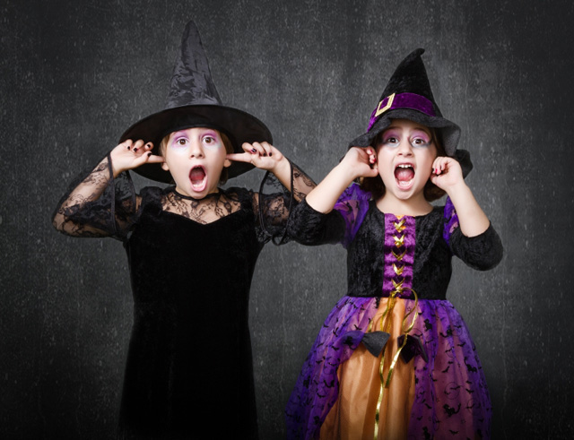 Two kids dressed in their Halloween costumes