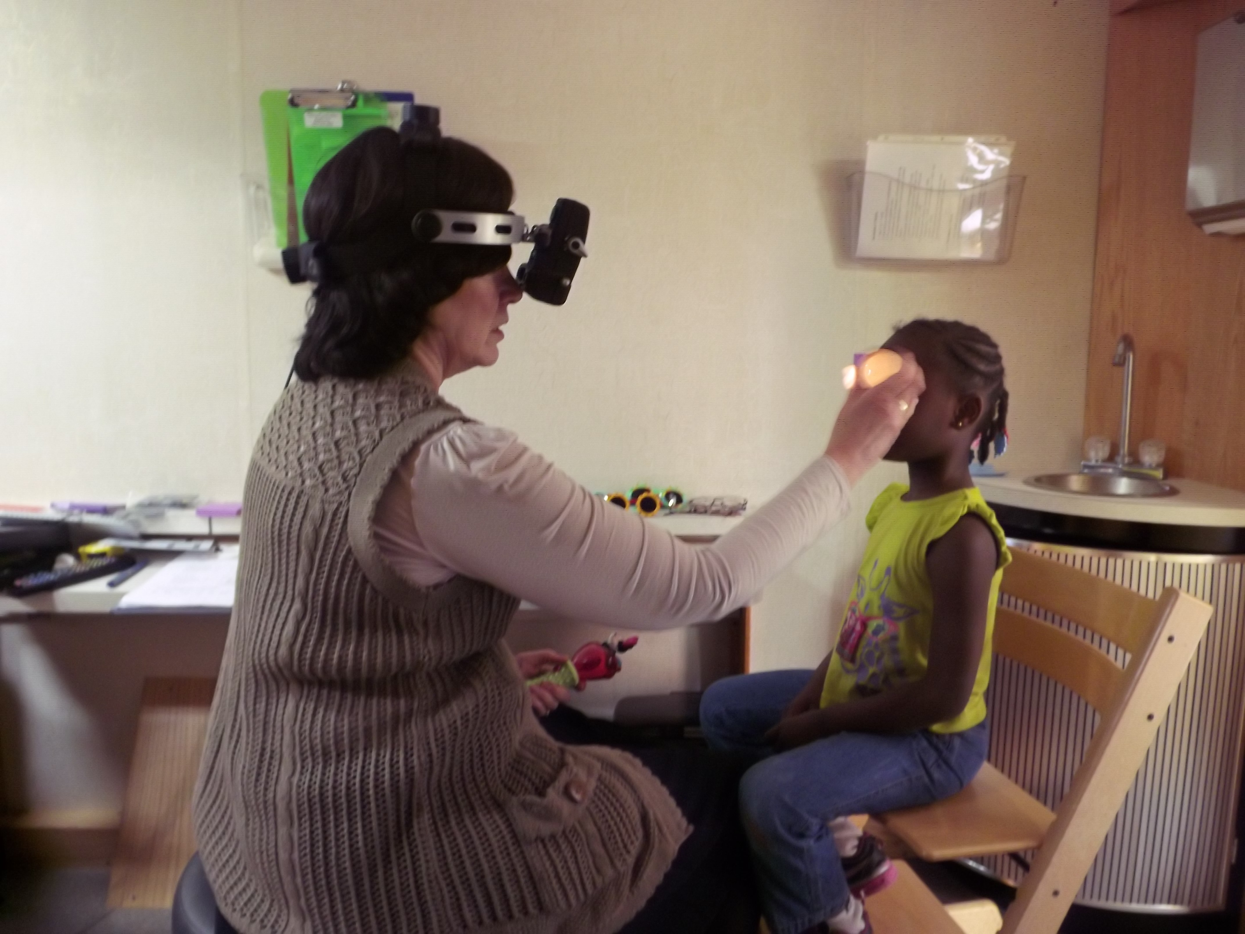 Dr. Elise Ciner examines young patient at TEI