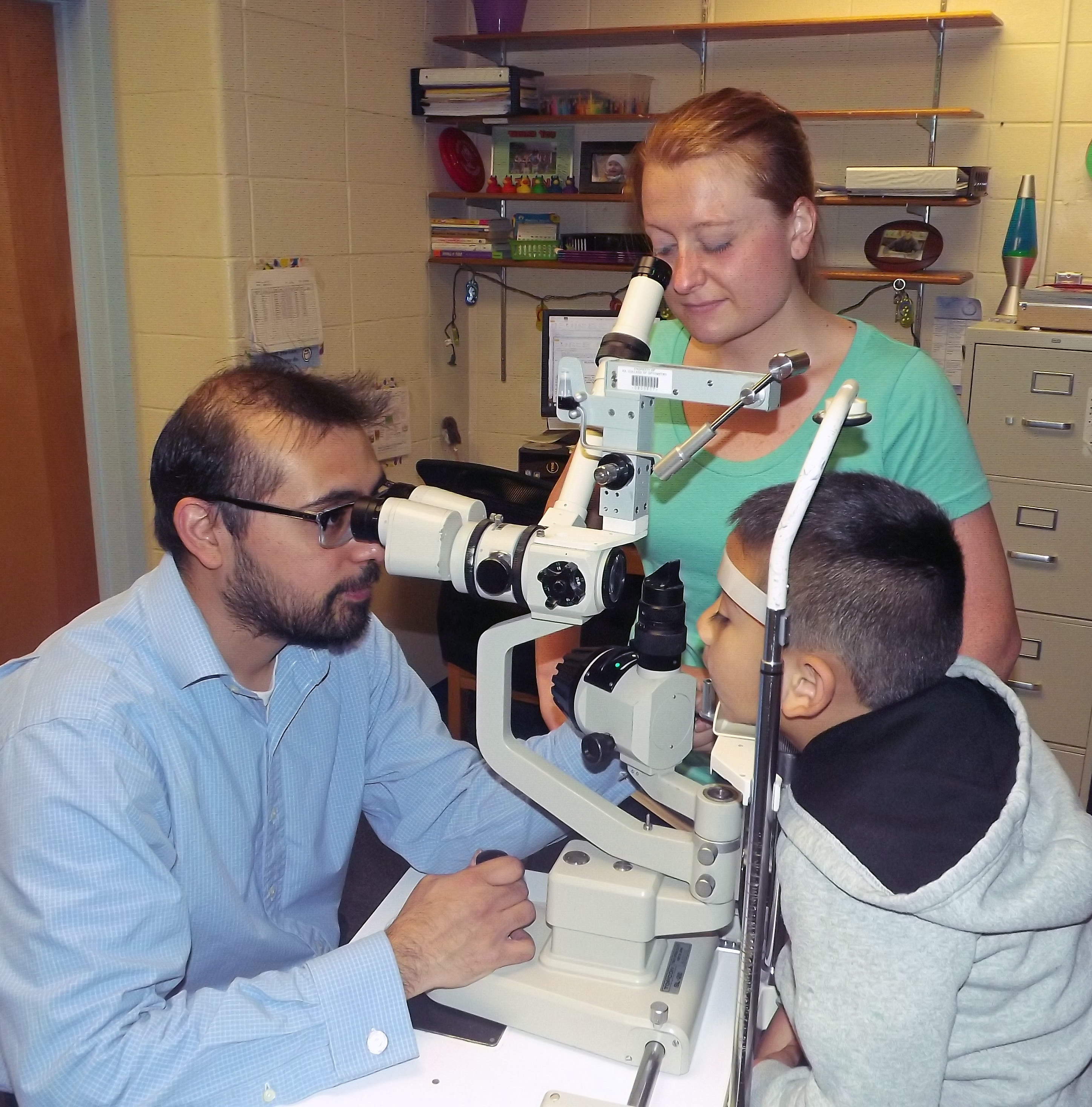 Dr. Luis Trujillo examines young patient at TEI