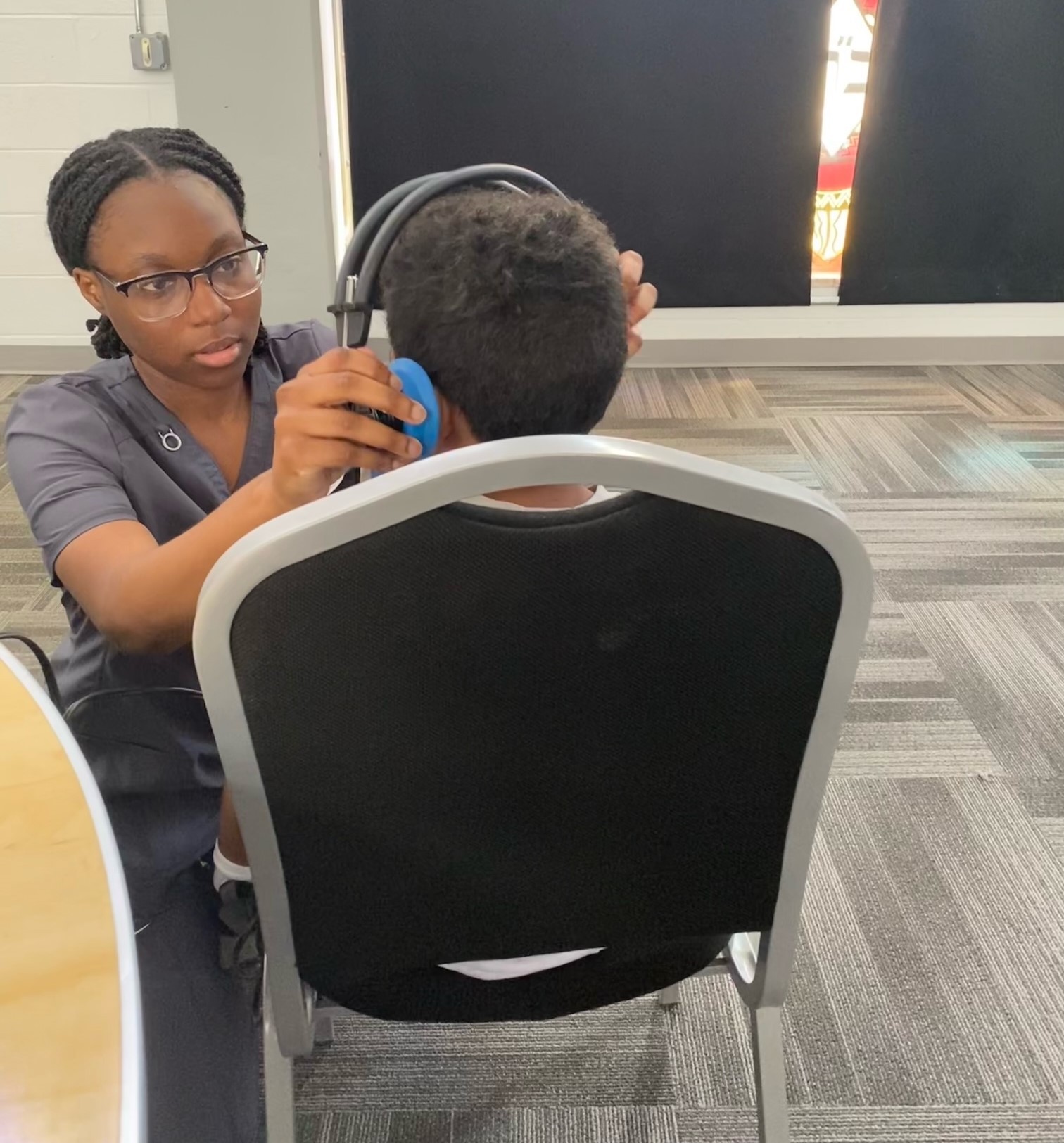 Hearing test being done on young student