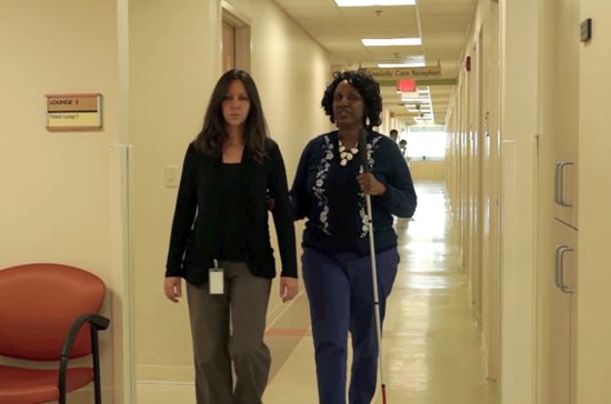 Virginia Scott working with a patient at TEI