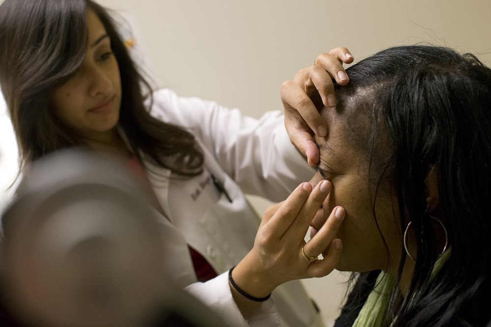 Optometrist working with a patient