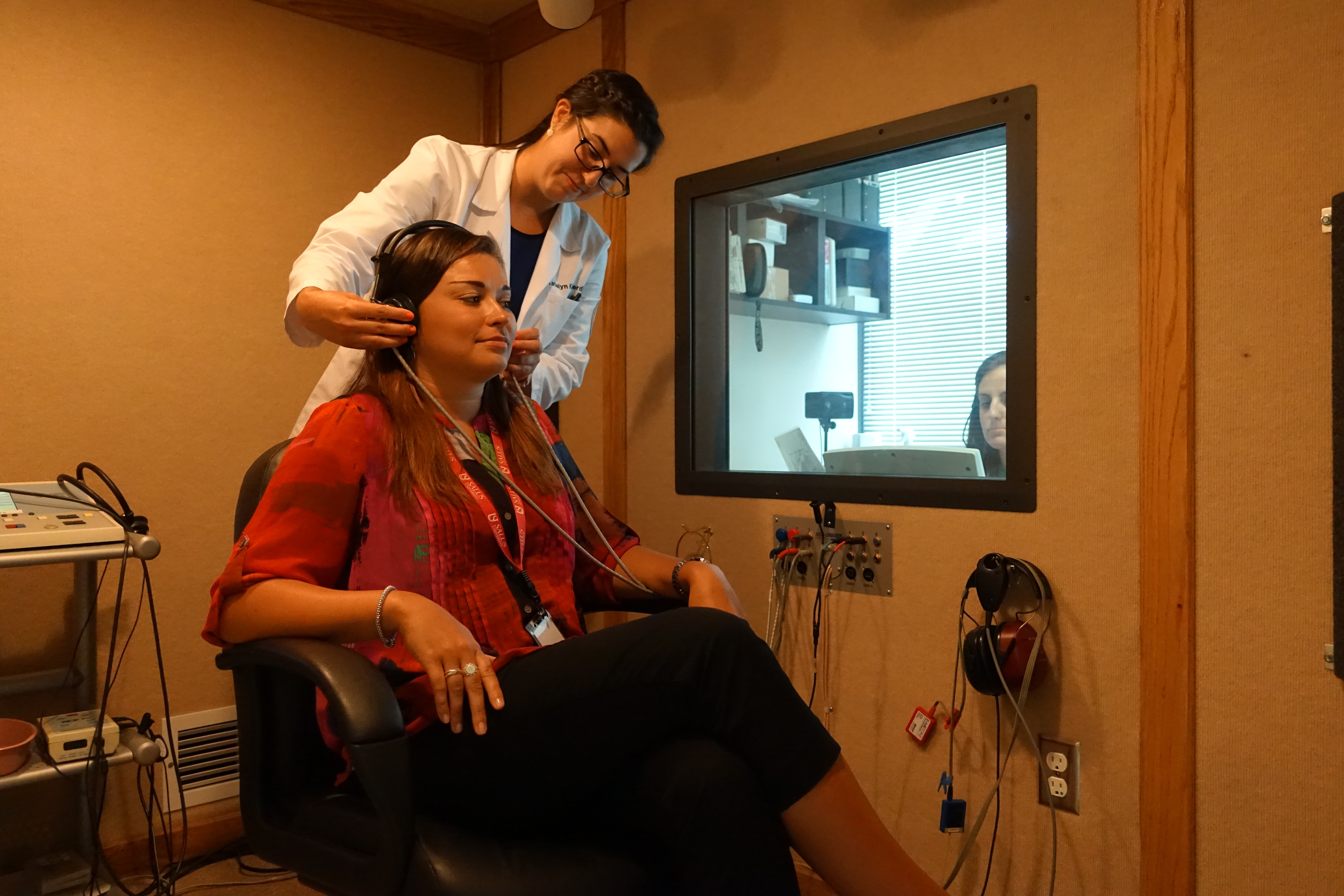 Student with patient in hearing booth at PEI