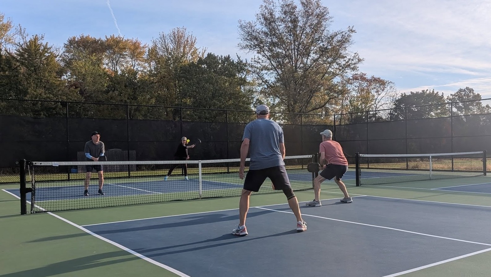 Four pickleball players on the court pic