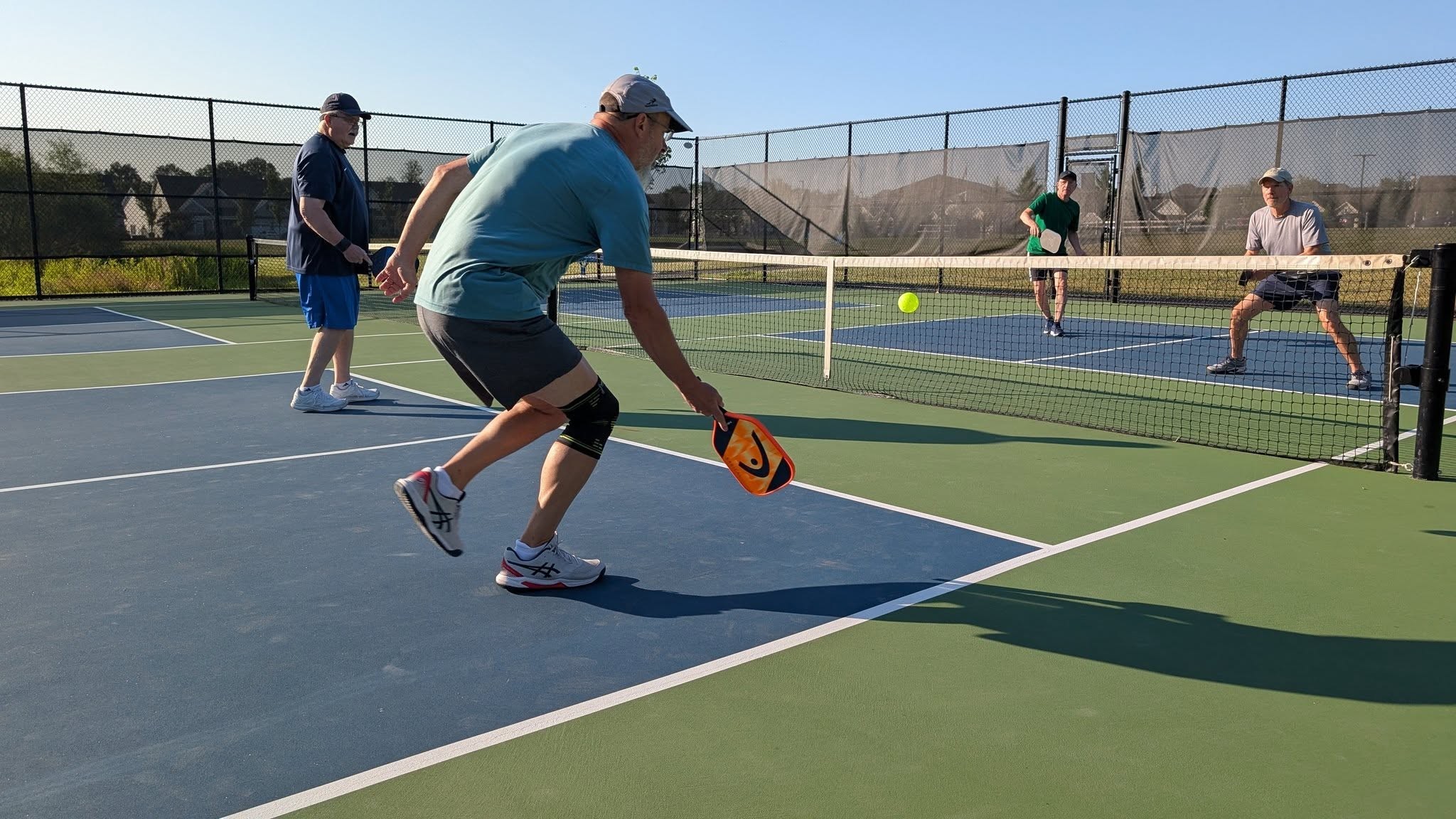 Four pickleball players on the court pic1