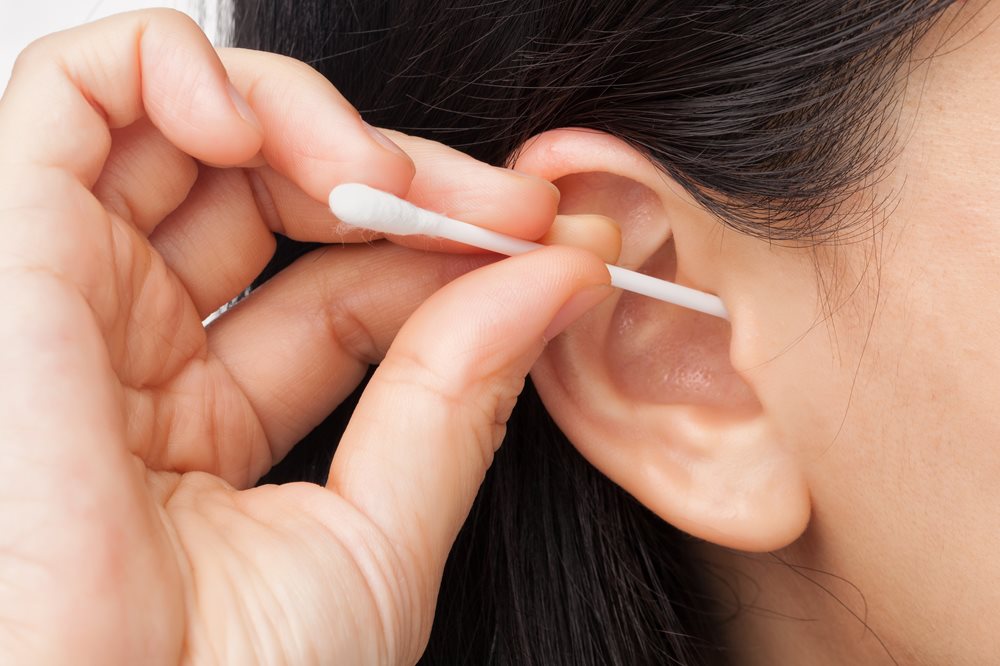 Ear cleaning with a cotton swab pic