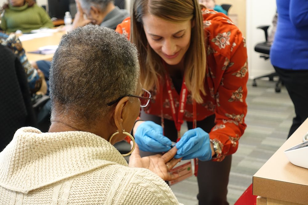 Student does blood sugar test on patient