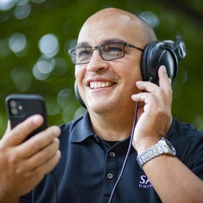 Man listening to music on headphones thumb1