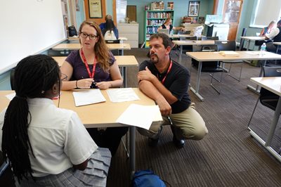 Bob Serianni sitting with child client