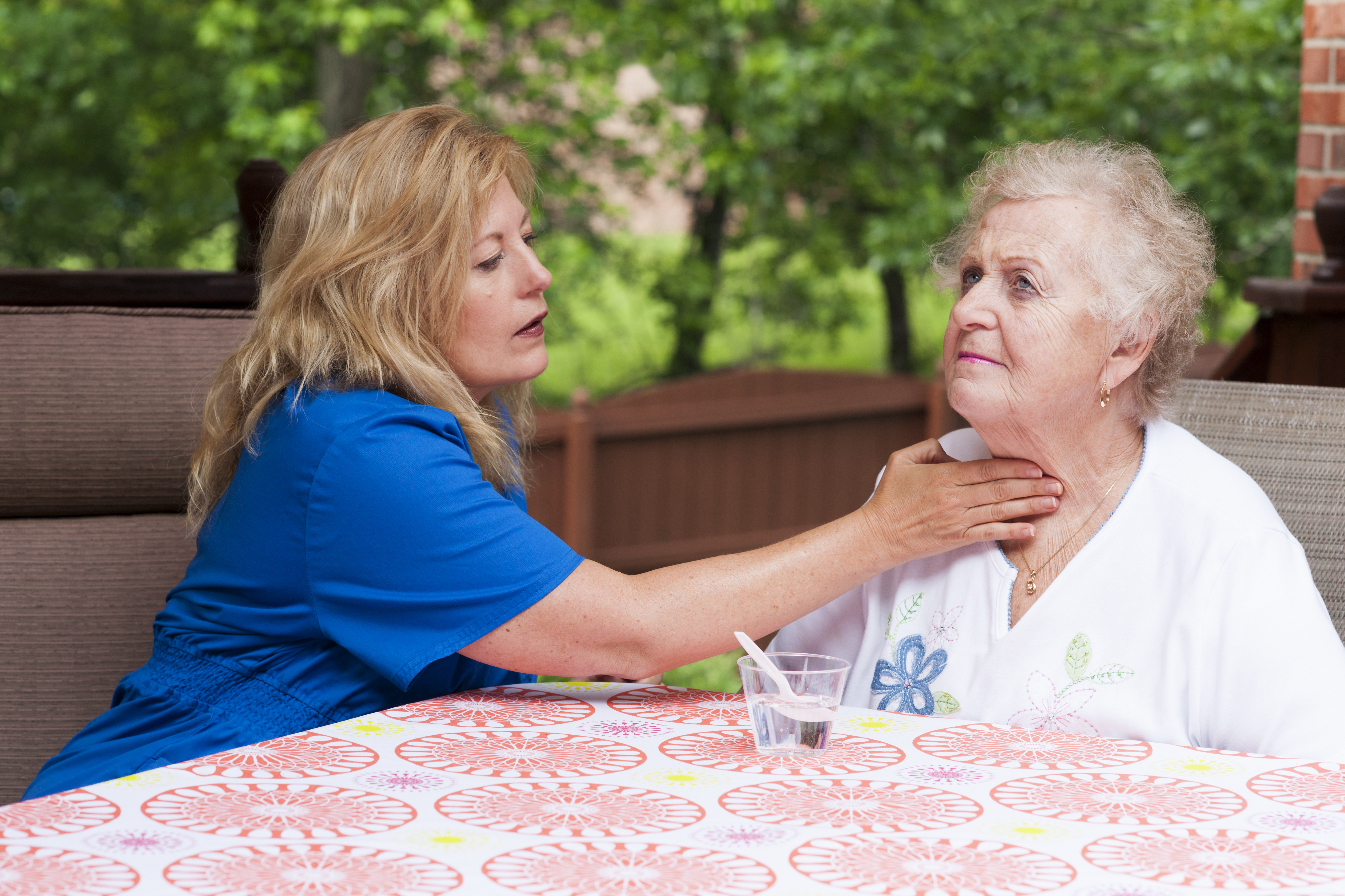 SLP working with swallowing patient pic