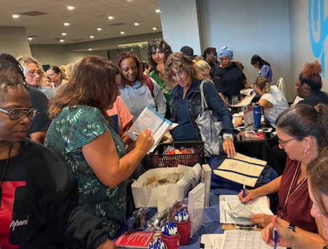 TEI table packed at community event