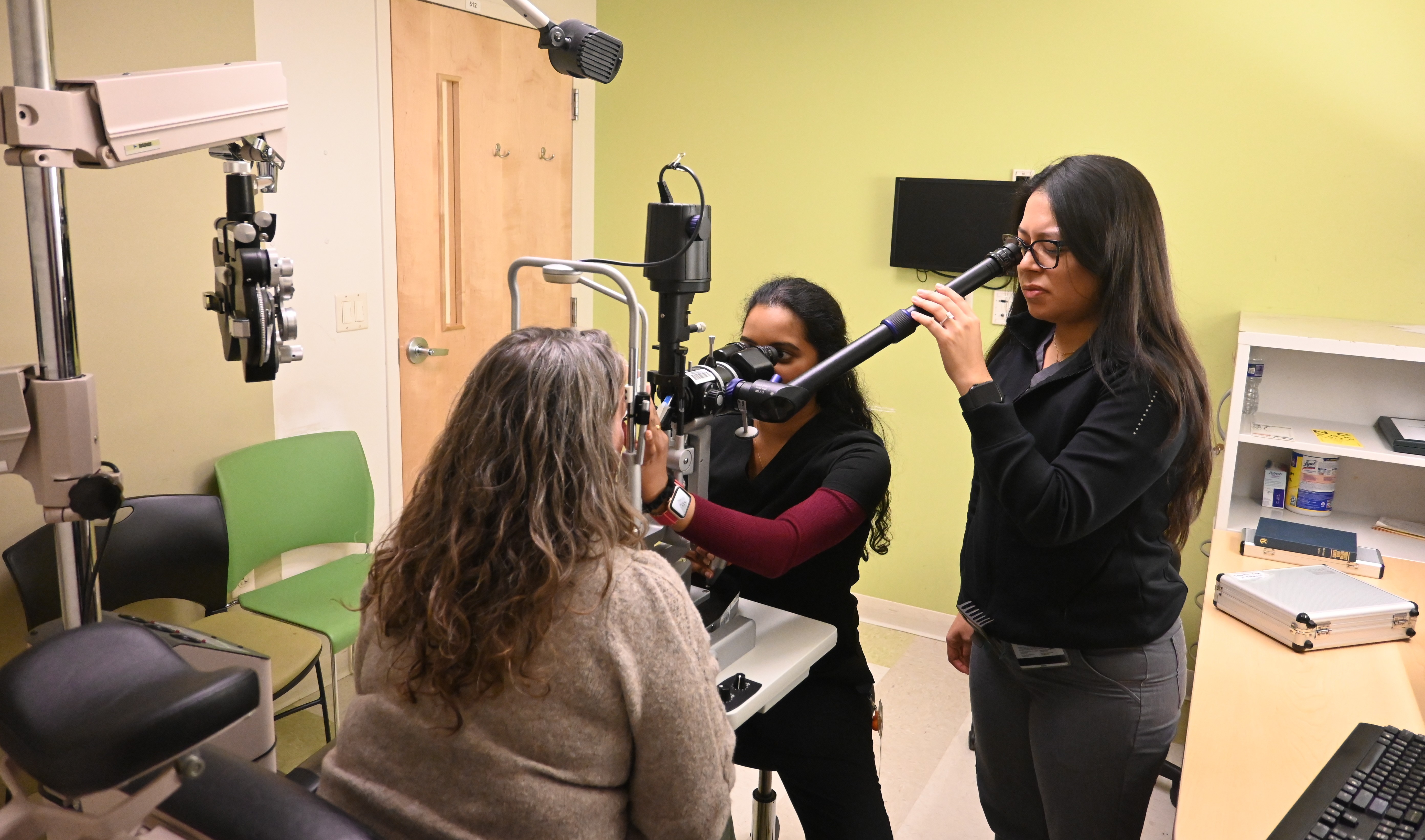 Three students in a TEI exam room pic4