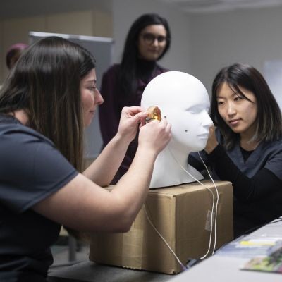 Students working on ear model in lab thumbpic1
